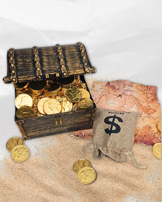 A prop representation of a chest filled with gold-wrapped chocolate coins spilling out onto a surface, with a hessian bag marked with a dollar sign.