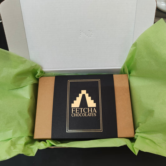 Image shows a closed box of Fetcha Chocolates handmade Shop Favourites collection of filled chocolates, which are vegan, dairy free, gluten free and soy free and come in plastic-free packaging.
