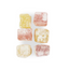 Image shows 6 pieces of vegan turkish delight, yellow and pink for lemon and rose, being sold by Fetcha Chocolates