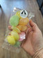 Image shows a clear packet of colourful flying saucer sweets, being sold by Fetcha Chocolates