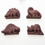 Image shows four Fetcha Chocolates handmade solid milk chocoloate 3D dinosaur decoration. The lollipops are vegan, dairy free, gluten free and soy free and come in plastic-free packaging.