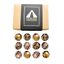 Image shows Fetcha Chocolates handmade Classic collection (a mix of milk, dark and white chocolate) which are vegan, dairy free, gluten free and soy free and come in plastic-free packaging. Image shows twelve chocolates sitting next to a kraft box with black and gold branding.
