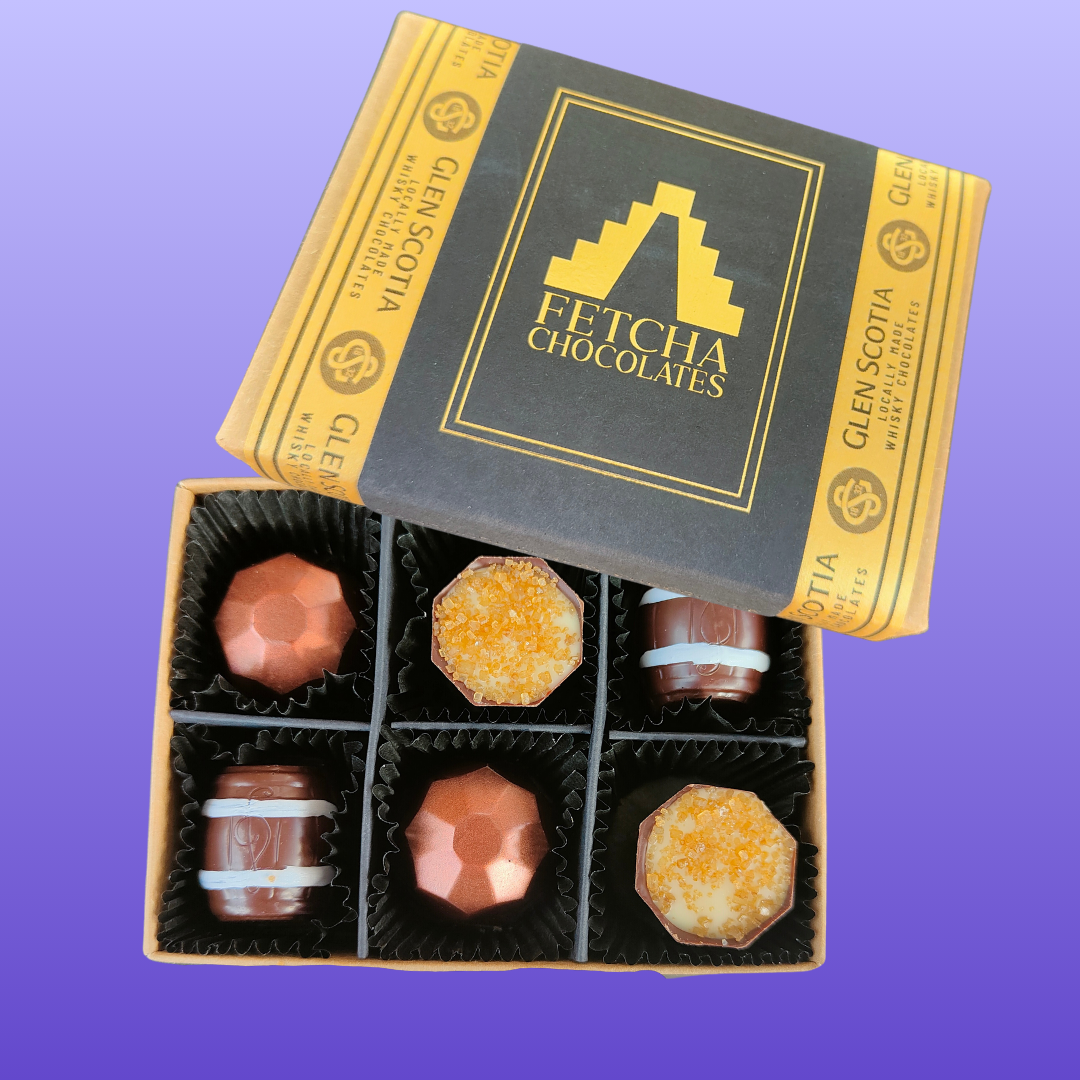 Image shows Fetcha Chocolates handmade Glen Scotia filled chocolate collection. These chocolates are vegan, dairy free, gluten free and soy free and come in plastic-free packaging.  This box of chocolates is made with Glen Scotia whisky.