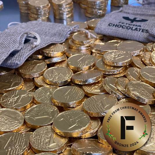 Image shows fetcha chocolates foil wrapped dairy-free and gluten-free chocolate coins with Free from Christmas bronze award 2024