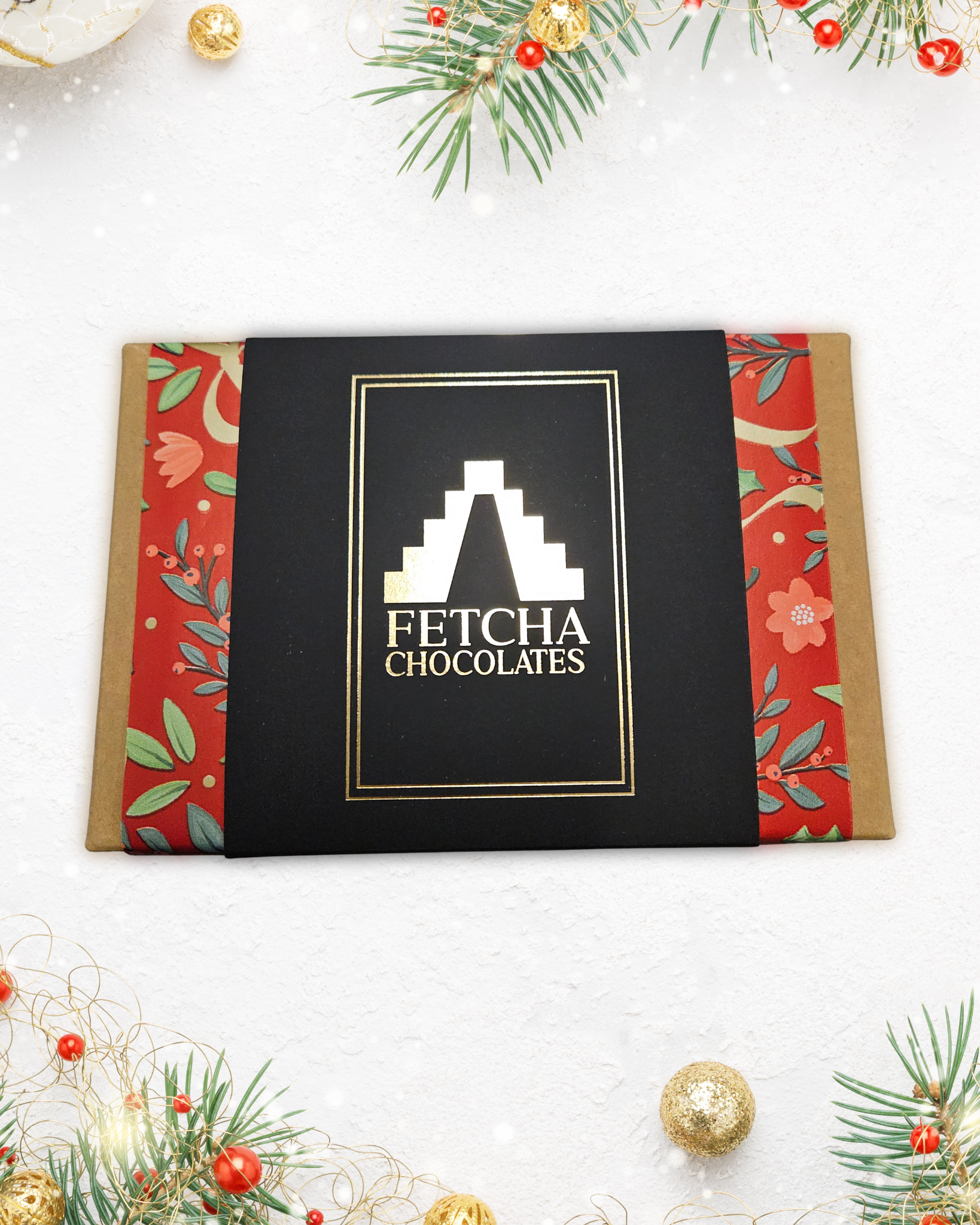 Fetcha Chocolates Chirstmas collection packaging with decorative elements on a white background