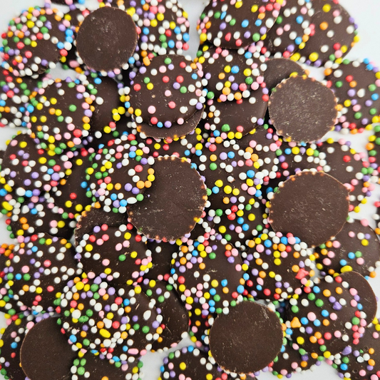 Dairy-free hocolate jazzies with colourful sprinkles on a white background
