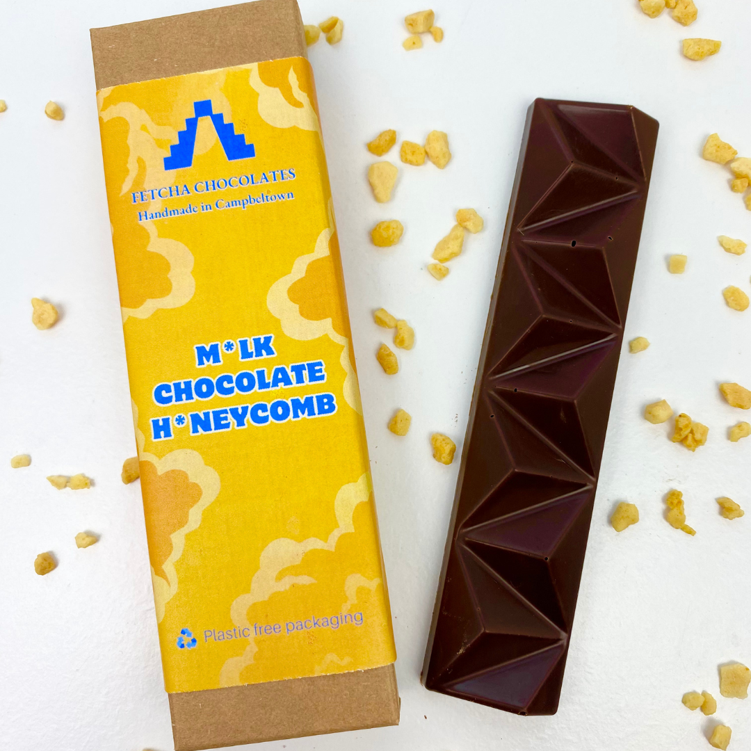 Image shows fetcha chocolates milk chocolate honeycomb bar. Vegan, dairy free and gluten free