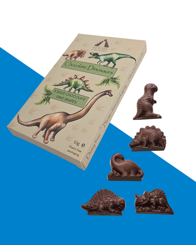 Chocolate dinosaur shapes with packaging on a blue and white background from Fetcha Chocolates