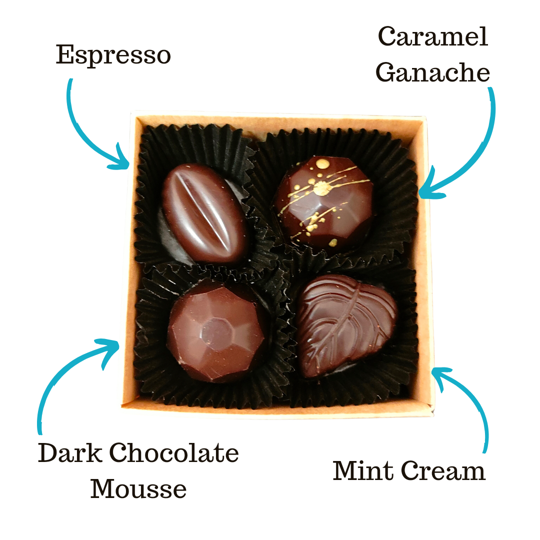 Image shows Fetcha Chocolates handmade box of four dark filled chocolates, with labels highlighting the different flavours. These chocolates are vegan, dairy free, gluten free and soy free and come in plastic-free packaging. 