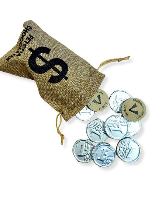 Hessian bag with a dollar sign and vegan white chocolate coins on a white background