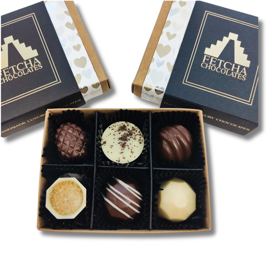 Image shows Milk and white valentines collection off vegan, dairy free and gluten free chocolates from Fetcha Chocolates