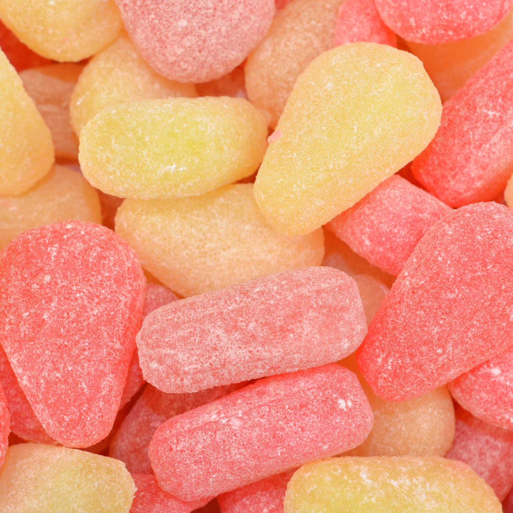 Image shows pink and yellow sugar free pear drops