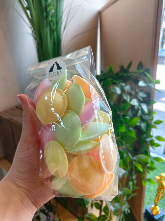 Image shows a clear packet of colourful flying saucer sweets, being sold by Fetcha Chocolates