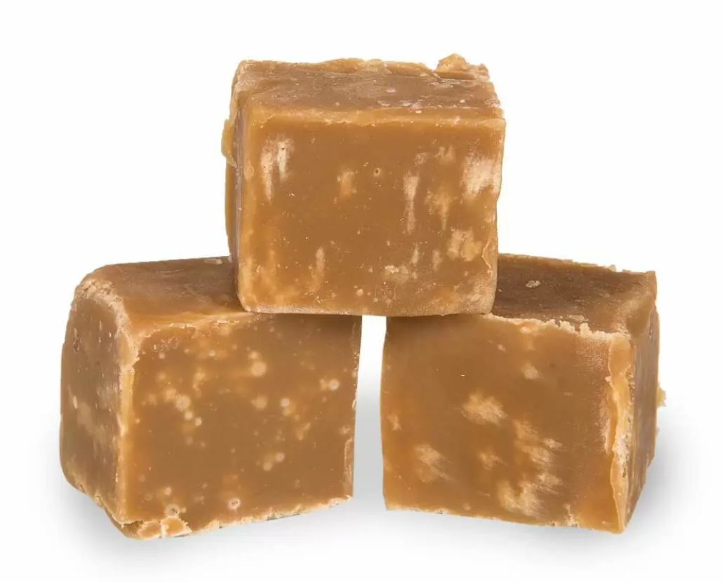 Image shows three stacked pieces of salted caramel fudge being sold by Fetcha Chocolates